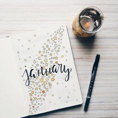 an open notebook with the word january written on it