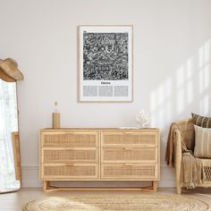 a living room with white walls and wooden furniture in front of a large poster on the wall