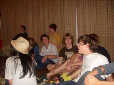 a group of young people sitting on the floor