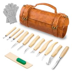 a leather tool kit with wooden handles and tools in it, including a knife case