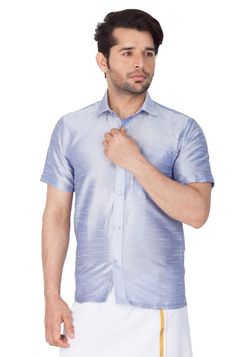 Vastramay brings to you this Stylish yet Comfortable Men Bluish White Ethnic South Indian Shirt. Adorn it for a perfect Classy and Trendy look. These Shirts are usually very popular in Souther part of the Sub Continent. These are also called Madras Shirt. It is worn along with a trouser or a jeans. However, traditionally it is paired with a mundu or a white dhoti. The set is also called as Shirt Vesty.Product Features :  Top Color: Light Blue Top Fabric: Cotton Art Silk Product Type: Ethnic Sout Traditional Festive Short Sleeve Shirt, Traditional Short Sleeve Festive Shirt, Casual Short Sleeve Kurta For Festive Occasions, Short Sleeve Tops For Eid Festivities, Festive Short Sleeve Tops For Eid, Traditional Blue Fitted Shirt, Traditional Fitted Blue Shirt, Traditional Short Sleeve Tops For Eid, Blue Fitted Short Sleeve Kurta