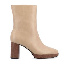 Looking to take your style to the next level? Look no further than the Romer booties from Journee Collection. These booties are made from high-quality vegan leather, making them both stylish and easy on the feet. With a faux wood platform and block heel, these booties are right on-trend. The center seam detail and almond toe give them a chic and sophisticated look. And with a 10 1/2-inch top circumference and comfortable 4 mm Tru Comfort Foam™ insole, they're as comfortable as they are stylish. Fall Ankle Boots With Wooden Heel, Leather Heeled Boots With Wooden Heel For Fall, Fall High Heel Boots With Wooden Heel, Ankle-high Boots With Wooden Heel For Fall, Fall Boots With Wooden High Heel, Chic Fall Boots With Wooden Heel, Faux Leather Boots With Block Heel And Leather Lining, Faux Leather Boots With Leather Lining And Block Heel, Leather Boots With Wooden Heel And Medium Width