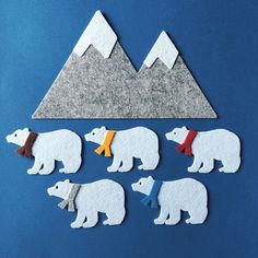 polar bears cut out from felt with mountains in the background