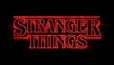 the title for the television series,'strange things'is shown in red neon letters