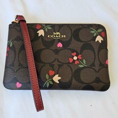 Nwt Coach Brown Multi Wristlet. Has A Gold Tone Zipper With A Burgundy Leather Wrist Strap, And 2 Inside Card Pockets. Retails $88. Brown Flowers, Wrist Strap, Coach Bags, Gold Tones, Bag Lady, Zipper, Flowers, Red, Leather