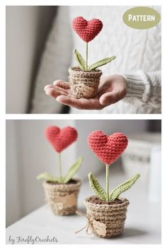 crocheted hearts are placed in small pots on the table, and one is holding a plant