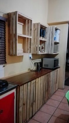 a kitchen with wooden cabinets and appliances in it