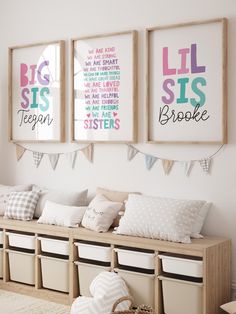 three framed pictures hang on the wall above a bench with storage bins and baskets