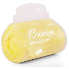 a white and yellow blanket sitting on top of a plastic container next to a roll of toilet paper