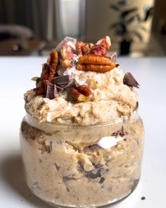 a jar filled with food sitting on top of a table