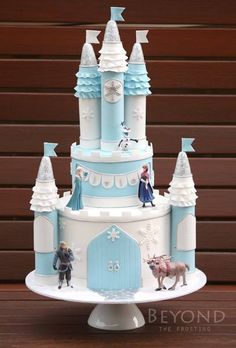 this is a cake that looks like it has been made to look like disney's castle