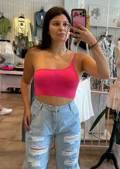 This hot pink ribbed one shoulder tank is a staple piece in your wardrobe. It features a cropped fit and has thin spaghetti straps. Dress it up with a mini skirt and heels or dress it down with boyfriend jeans and sneakers. The outfits with this top are endless! Once you get your hands on it, you will need it in every color. Complete the look with our Designer Nameplate Necklace ★ Gold. Model Info Meet Kira! These are all one size. Hips: 36.5" | Waist: 28" | Bust: 33" | Height: 5’3" Space The De Pink Tank Top Outfit, Pink Tank Tops Outfit, Pink Blouses Outfit, Spaghetti Straps Dress, One Shoulder Tank, Hot Pink Blouses, Straps Dress, Tank Outfit, Pink Ribbed