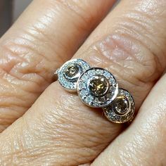 a woman's hand with two rings on it