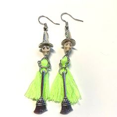 Add a whimsical touch to Your Halloween with these Handmade Tassel Witch Skull Skeleton Halloween EarringsMaterial: zinc alloyMeasurements: 3 in lengthElegan... Adjustable Nickel-free Earrings For Halloween, Halloween Novelty Metal Earrings, Green Novelty Earrings For Halloween, Witchy Adjustable Earrings For Halloween, Adjustable Witchy Earrings For Halloween, Witchy Halloween Earrings Adjustable, Bohemian Metal Earrings For Halloween, Whimsical Halloween Dangle Jewelry, Green Halloween Dangle Earrings