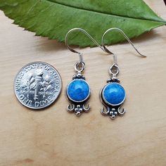 Visit our on-line shop at: Etsy.com/shop/AlbuquerqueDesigns *sterling silver earrings *dangles / drops *southwestern jewelry *blue denim / blue stone *calibrated pre-cut stone: 8mm round shape *classic stone settings *all jewelry items are made to ship, slight variations in stones will occur comparing to pictures *size of a penny is 19mm or a dime is 18mm dime for comparing size with jewelry item *handcrafted in Albuquerque, New Mexico, USA *free convenient gift box *free shipping in USA *seller Blue Drop Earrings For Everyday Wear, Casual Blue Earrings For Pierced Ears, Everyday Blue Drop Earrings, Nickel Free Blue Earrings, Nickel Free Blue Earrings For Everyday, Blue Sterling Silver Single Earring, Blue Single Sterling Silver Earring, Single Sterling Silver Blue Earring, Blue Nickel-free Earrings