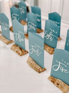 place cards are placed on wood for guests to sign