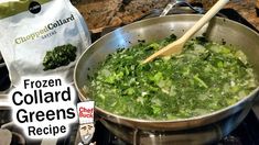 a pot filled with green vegetables on top of a stove next to a bag of frozen collard greens