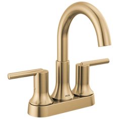 a gold faucet with two handles