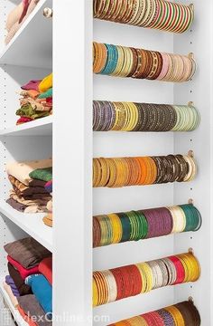 an organized closet filled with lots of different colored bracelets