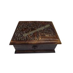 an ornate wooden box with carvings on it