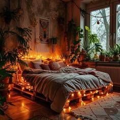 a bed with lots of lights on it in a room filled with plants and potted plants