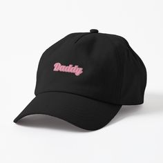 a black dadly hat with pink lettering on the front