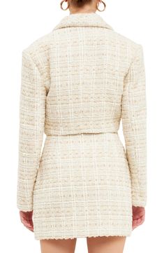 This woolly tweed jacket is designed in a cropped silhouette with golden buttons. Notched collar Lined 80% polyester, 20% wool Hand wash, dry flat Imported Chic Boucle Outerwear For Fall, Chic Cream Tweed Outerwear, Elegant Cream Cropped Jacket For Fall, Chic Cream Tweed Jacket For Formal Occasions, Chic Beige Tweed Jacket, Elegant Cropped Beige Outerwear, Elegant Cream Cropped Jacket For Work, Elegant Beige Cropped Outerwear, Chic Fitted Tweed Cropped Jacket