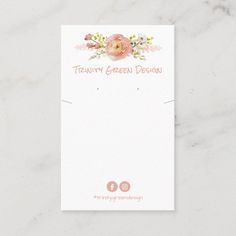 a white card with pink flowers and greenery on the front, reads twenty green designs