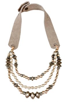 The Twine & Twig Marrakech Necklace is designed with silver metal and globally sourced beads that are strung onto individual strands and tied together onto our signature branded suede straps. The necklace features two length options with a brass snap closure.Tied onto a pair of Suede Straps.Twine & Twig jewelry may have slight variations and natural imperfections enhancing its raw, handcrafted look.Please reference secondary images for the approximate length of the necklace. Adjustable Multi-strand Necklace With Polished Beads, Adjustable Multi-strand Polished Beads Necklace, Adjustable Multi-strand Metal Beads Jewelry, Everyday Silver Leather Necklace, Silver Hand-strung Multi-strand Necklaces, Silver Double Strand Hand-strung Necklace, Adjustable Long Beaded Necklace With Silver Beads, Adjustable Silver Double Strand Beaded Necklaces, Adjustable Multi-strand Metal Beaded Necklace