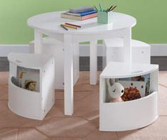 a white table with two storage bins underneath it and books on the top shelf