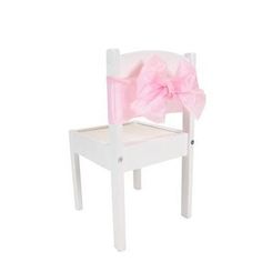 a white wooden chair with a pink bow on it's back and seat cover