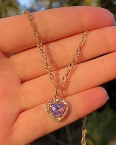 "The cutest little heart charm necklace in a baby pastel purple 𝓓𝓔𝓣𝓐𝓘𝓛𝓢 ♡ 16-18 inch adjustable ♡ 0.5\" cubic zirconium charm ♡ 18k triple gold electroplated chain + color retention ♡ hypoallergenic This necklace makes the perfect gift for yourself or a loved one! 𝓒𝓐𝓡𝓔 𝓘𝓝𝓢𝓣𝓡𝓤𝓒𝓣𝓘𝓞𝓝𝓢 ♡ - Keep your jewelry in a cool, dry environment to ensure the longevity of the product. Plated jewelry can last years with proper care! - Avoid contact with oils, perfumes and other chemicals - Cute Purple Jewelry With Heart Charm, Jewelry Y2k, Diamond Heart Necklace, Heart Charm Necklace, Purple Diamond, Heart Necklace Diamond, Purple Jewelry, Jewelry Accessories Ideas, Dope Jewelry