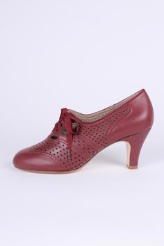 Featuring classic 1930s-style, these everyday oxford high heels are a timeless addition to your wardrobe. The shoe features a 7.2 cm Spanish Medium high heel inspired by the earliest fashion of the 1930s, complete with classic 30s cutouts and a hole pattern. The wide, grosgrain ribbon laces provide a uniquely feminine and elegant look. This heel is an exact replica of an original 1930s heel and is designed for balanced and comfortable wear. The leather outsole allows the shoe to be breathable an Oxford High Heels, High Heel Oxfords, 1930s Shoes, 1950s Shoes, 1920s Shoes, 1940s Shoes, 1930s Style, Ribbon Laces, Winter Fashion Boots