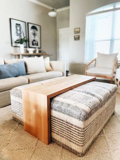 a living room filled with furniture and a wooden coffee table