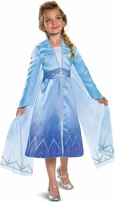 This Elsa prestige costume is so authentic your child will feel like they are in the movie! The dress is full printed with a high-shine glitter print and mini sequin details on the bodice. The flowing organza cape sparkles with high-shine glitter print. Polyester Officially licensed product - Disney Frozen 2 Product includes: dress with zipper closure and Attached cape. Satin dress features fully printed design with high-shine glitter printed and mini sequin detail on bodice. Skirt features box pleat in the front. Organza cape really sparkles with a high-shine glitter print Matte satin belt features glittery sparkles Elsa Costume For Kids, Movie Fancy Dress, Frozen Halloween, Cute Frozen, Frozen 2 Elsa, Frozen Elsa Dress, Elsa Costume, Elsa Dress, Sleek Dress