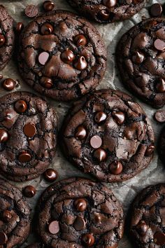 chocolate chip cookies are arranged on top of each other with chocolate chips in the middle