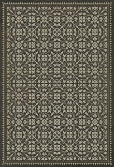 a black and white rug with an intricate design