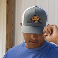 Keeping the hot southern sun out of your eyes and away from your face is important during the heat of June, July and August--both for guys and gals. Our classic, wide-brimmed trucker hat subtly announces your southern roots while shading your head and face. Crown: Structured Pro Crown | Pro-Stitched Finish | Adjustable Snap-Back Visor: Pre-Curved | Curved or Flat - Shape It How You WantSweatband: 3-Part Comfort Cotton FitClosure: Plastic Adjustable Snap-Back Sizes: Adult | One Size Fits Most Casual Lightweight Trucker Hat, Casual Snapback Hat With Wide Brim For Outdoor, Lightweight Casual Trucker Hat, Casual Wide Brim Snapback Hat For Outdoor, Gray Curved Bill Hat For Summer, Casual Flat Brim Hat, Pre-shrunk, Casual Gray Sun Hat With Curved Brim, Gray Curved Bill Trucker Hat For Summer, Gray Summer Trucker Hat With Curved Bill