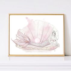 a mermaid sitting on top of a shell with a pearl in her hand and a pink background