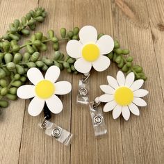 "Looking for a cute compliment to your badge buddy? This cute flower badge reel is the perfect add-on!  PRODUCT DETAILS: - High-quality, retractable badge reel - VELCRO®-secured flower topper (~2\" diameter) - Durable 1/8\" thick, laser-precision-cut acrylic front - Reel cord length: 24\" (60 cm)" Adjustable White Badge Holder For Hobby, Cute Compliments, Flower Topper, Nursing Badge Reel, Nursing Badge, Cute Badge Reel, Beaded Stuff, Festival 2024, Badge Buddy