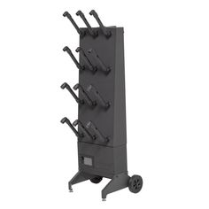 a metal rack with many different tools on it's sides and wheels attached to the wall