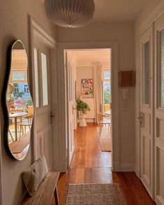 the hallway is clean and ready to be used as a dining room or living room