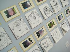 a wall covered in cartoon faces and pictures