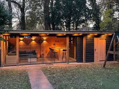 a small wooden shed with lights on it