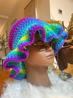 Stay stylish and on-trend with this handmade crochet ruffle hat. Made with soft and durable yarn, this hat is perfect for adding a touch of boho-chic to any outfit. The classic ruffle/bucket hat style is updated with a unique crochet design, making it a versatile and fashionable accessory for any season. Whether you're out for a day of shopping or heading to the beach, this hat is sure to keep you looking cool and feeling comfortable. Treat yourself or a loved one to this must-have accessory and add a touch of handmade charm to your wardrobe. Handcrafted with care and attention to detail, this crochet ruffle/bucket hat is a true statement piece that you'll love to wear again and again. Thank you for supporting my business and choosing handmade! CARE: Hand wash in cold water with detergent. Hippie Crochet Hat For Beach, One Size, Hippie Crochet Beach Hat, One Size, Hippie Crochet Beach Hat, Summer Wide Brim Hat With Ruffles, Hippie Style Crochet Beach Hat, Bohemian One-size Crochet Hat, Bohemian Beanie Crochet Hat, Bohemian Knitted Short Brim Hat, Bohemian Hand Knitted Crochet Hat