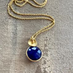 "Beautiful 24k gold vermeil necklace featuring a natural Sapphire and a twisted, textured disc. The pendant hangs on a fine 24k gold vermeil chain. Sapphire is the birthstone for September and is the traditional 5th & 45th wedding anniversary gift. Sapphire is associated with nobility, truth, sincerity, and faithfulness. This gorgeous necklace will make a perfect gift for any occasion.  This design is also available with other gemstones such as ruby, green onyx and carnelian. Dimensions: * Length: 1.8 cm ( 0.7\") * Width: 1.1 cm (0.4\") * Sapphire: 1 cm (0.3\") in diameter. Materials: * 24k gold vermeil (Vermeil is a thick coat of 24 karat gold on solid sterling silver.) *  Sapphire Metal: * Sterling silver The necklace will come in a beautiful gift box. * CHECK OUT MORE JEWELLERY *  www.e 45th Wedding Anniversary Gifts, 45th Wedding Anniversary, Sapphire Necklace Pendants, Thick Coat, Gift For Woman, Wedding Anniversary Gift, Sapphire Necklace, Green Onyx, Natural Sapphire