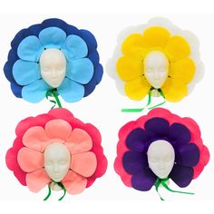 four different colored flower shaped hair clips on top of each other with one head in the middle