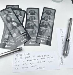 four black and white photos are on top of a table next to a fountain pen