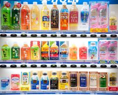 a vending machine filled with lots of different types of drinks in it's display