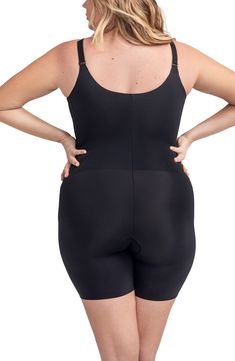 Comfortable, targeted compression sculpts the tummy, thighs and back in this shaping bodysuit that creates a smooth look under clothes. Medium compression V-neck Adjustable, convertible straps Open gusset Removable soft cups 64% nylon, 34% spandex Hand wash, dry flat Imported Fitted Shapewear Bodysuit With Built-in Padding, Compression Shapewear With Built-in Bra In Elastane, Compressive Lined Shapewear, Compressive Elastane Shapewear With Lined Body, Full Coverage Compression Bodysuit With Lined Body, Compressive Full Coverage Shapewear With Built-in Padding, Full Coverage Shapewear With Built-in Padding, Compressive Full Coverage Shapewear Bodysuit, Compression Shapewear With Built-in Padding